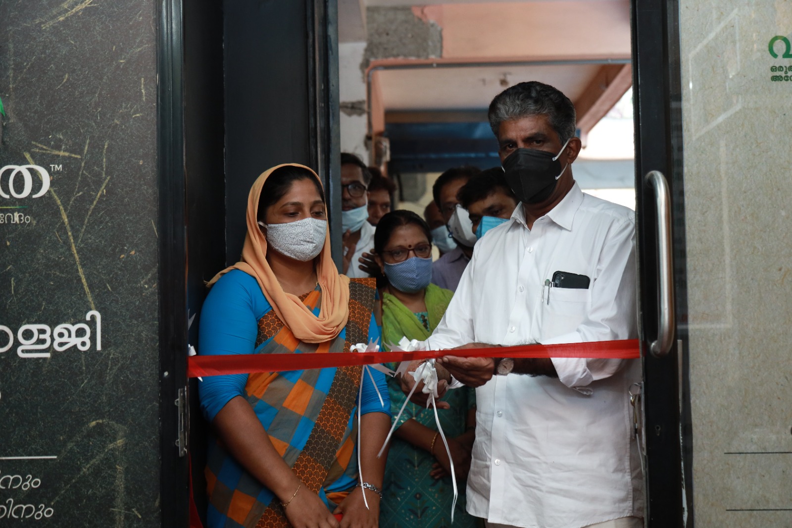 The ribbon being cut at the entrance to the Janamitra Ayurveda Centre on its opening day