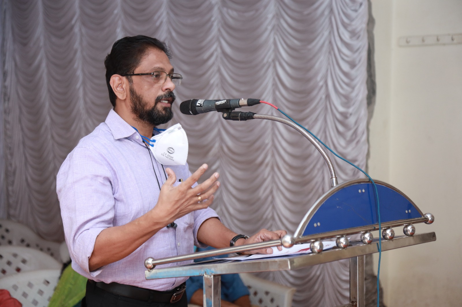 A speaker addressing the opening ceremony of the Janamitra Ayurveda Centre