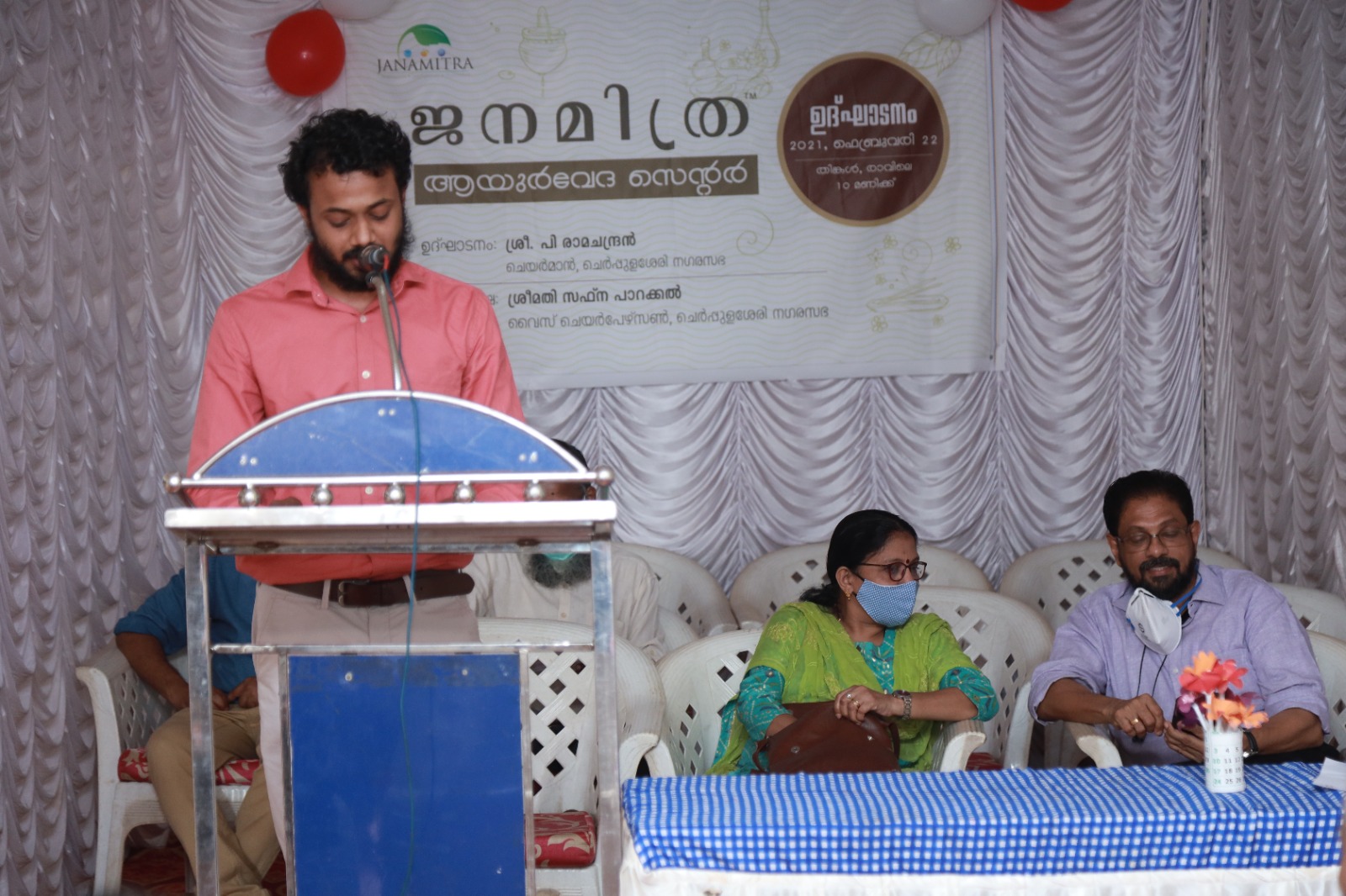 The welcome address at the Janamitra Ayurveda Centre opening, guests seated alongside