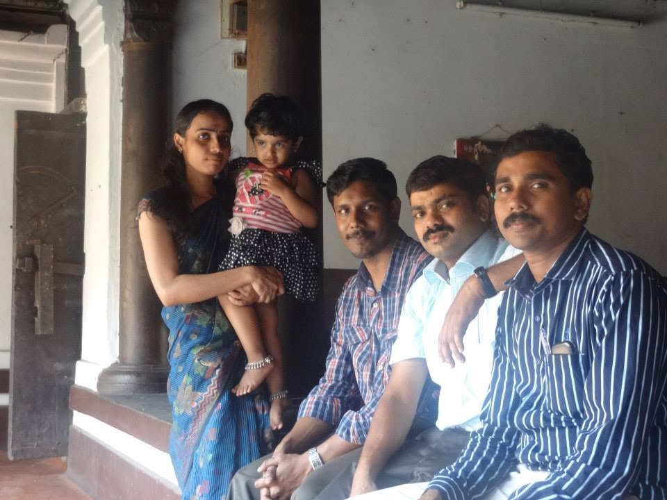 A family photographed under the veranda during a Janamitra visit