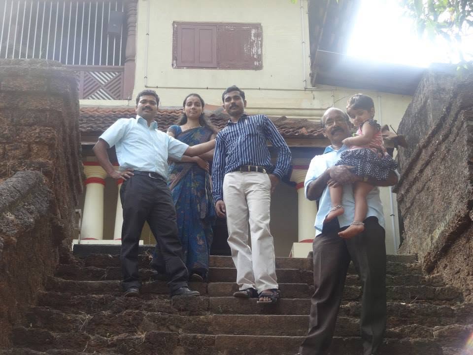 The Janamitra team on the steps of a building during a visit in the district