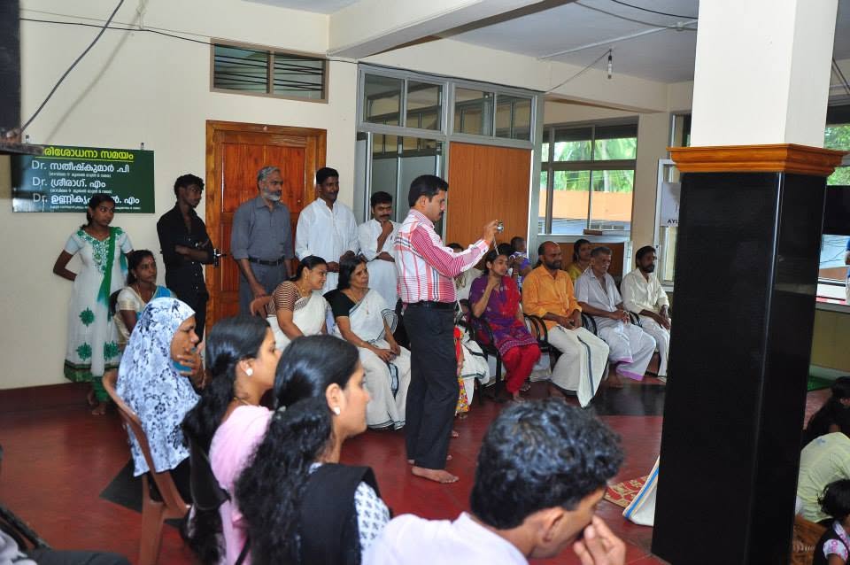 A gathering in the hall during a Janamitra community programme